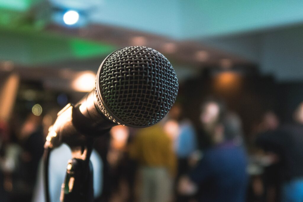 Mic in front of a crowd for public speaking