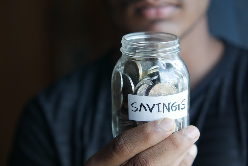 Savings in a jar. Saving is one example of effective budgeting