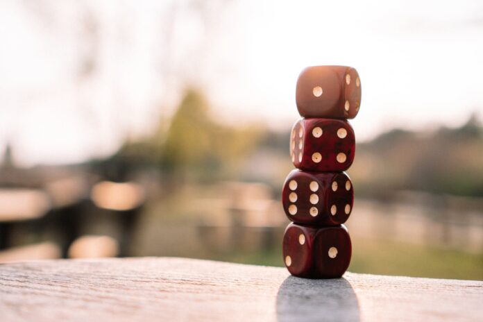 pexels-photo-4200740 red dice stacked on table on terrace